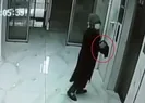Binalara giren kadın elindeki kimyasalı sürdü