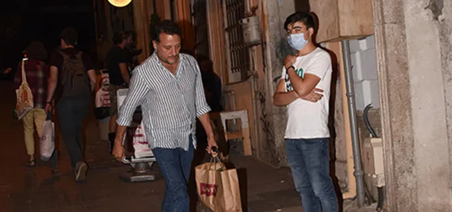 Sevgilisiyle yakalanan Yiğit Özşener kameraları görünce böyle kaçtı!