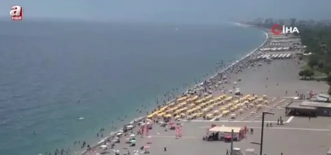 Termometreler 33 dereceyi gösterdi Konyaaltı Sahili doldu taştı