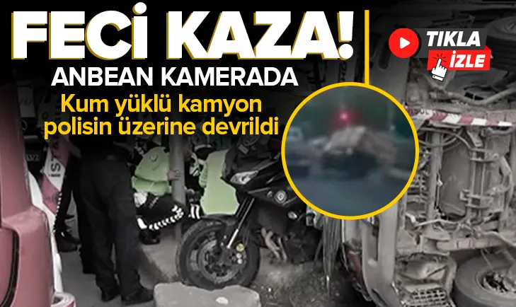 Kum yüklü kamyon polisin üzerine devrildi