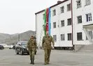 Aliyev Azerbaycan bayrağını öperek göndere çekti