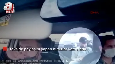 Çaldığı tabanca ile takside fotoğraf çekti