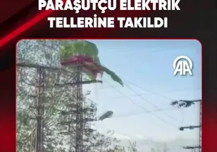PARAŞÜTÇÜ ELEKTRİK TELLERİNE TAKILDI