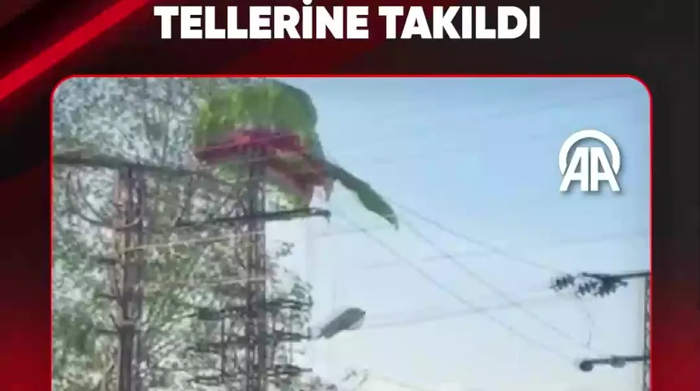 PARAŞÜTÇÜ ELEKTRİK TELLERİNE TAKILDI