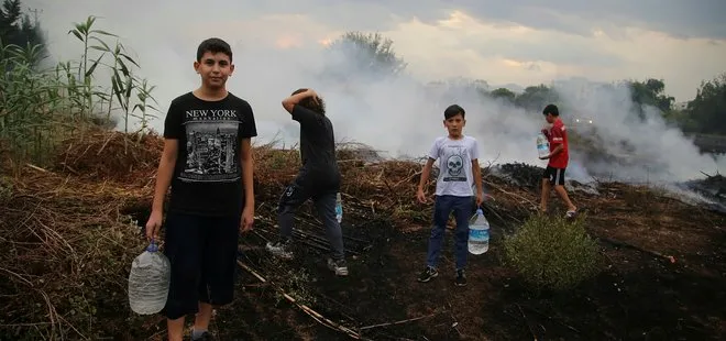 Antalya’da sosyal medyadan gördükleri yangına bidonlarla koştular
