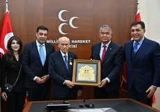 MHP Genel Başkanı Bahçeli’ye Ahmed Cevad Onur Madalyası verildi