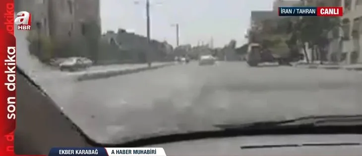 Dünyanın merak ettiği Tahran sokaklarından tek canlı yayın A Haber’de! Üst geçitte dikkat çeken pankart