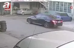 Otomobil, yolda yatan köpeğin üzerinden geçti