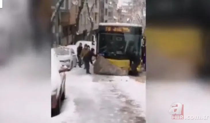 İstanbul’da karlı yokuşu çıkamayan İETT otobüsünün ilerlemesi için altına halı serildi