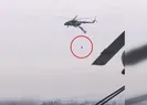 Askeri helikoptere takılıp havada asılı kaldı