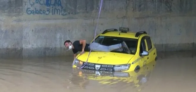 İstanbul’u sağanak yağış vurdu: Alt geçitte mahsur kalan taksici kurtarılmayı bekledi