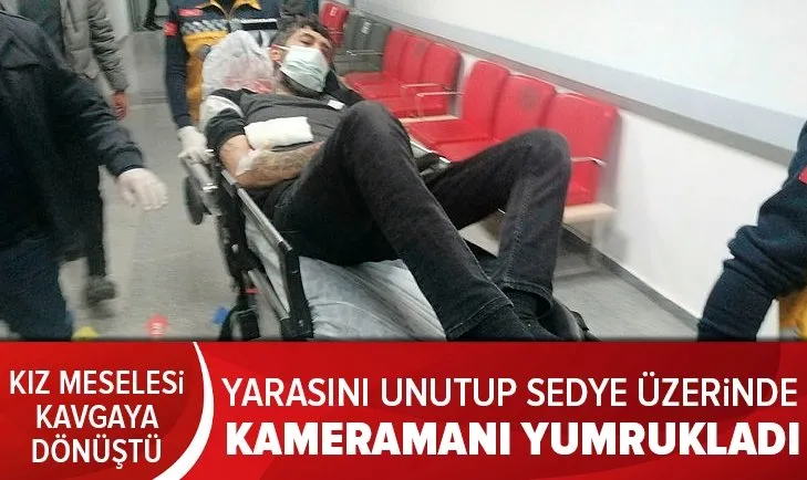 Yarasını unutup sedye üzerinden kameramanı yumrukladı