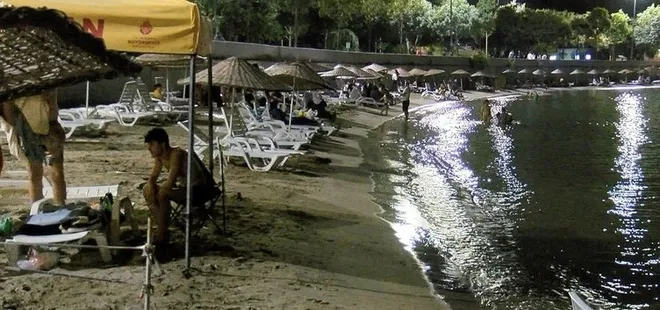 Sıcaklardan bunalan vatandaşlar sahillere akın etti! Yasak dinlemediler...