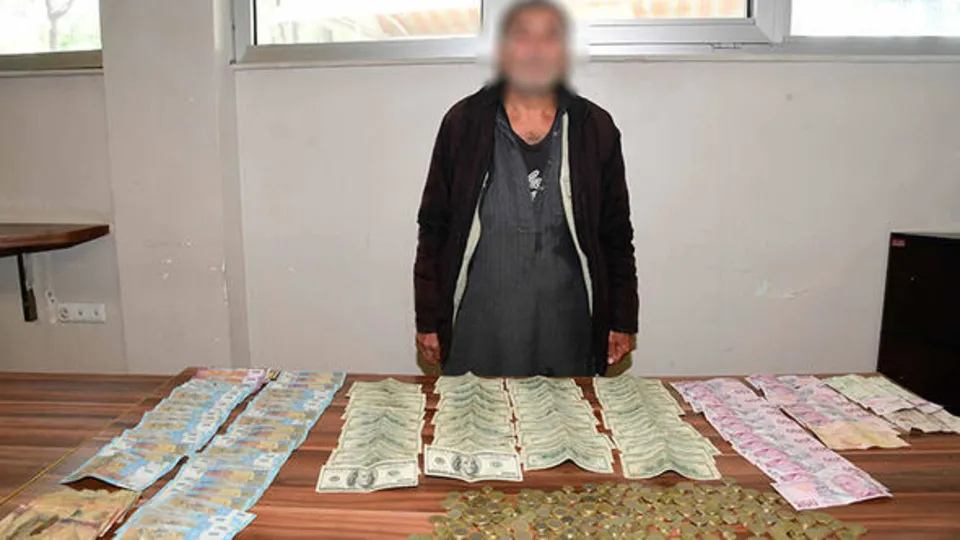 Üzerinden servet çıkan dilencide döviz bile var