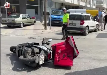 Otomobille çarpışan motokurye yaralandı