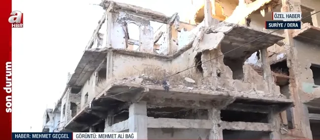 a-haber-suriyede-ic-savasin-basladigi-derada-savasin-aci-yuzu-1734597612294.jpg Dera'nın eski halinden eser kalmadı! (Ekran görüntüsü / A Haber)