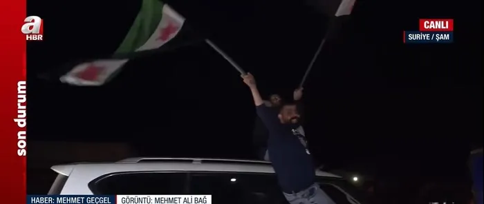 baas-rejimi-coktu-samdaki-kutlamalari-a-haber-goruntuledi-yediden-yetmise-herkes-meydanlarda-1734030172525.jpeg Şam'daki kutlamaları A Haber görüntüledi (Foto: ahaber.com.tr ekran görüntüsü)