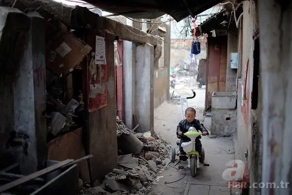 Evlerini yıktırmayarak gökdelenere direnen mahalleden 15 kare 1