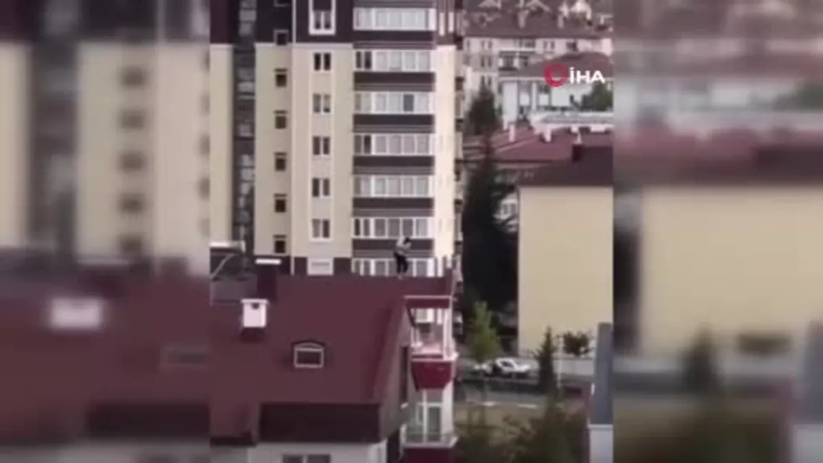 Nevşehir’de 10 katlı binanın çatısında yürekleri ağza getiren hareketler kamerada