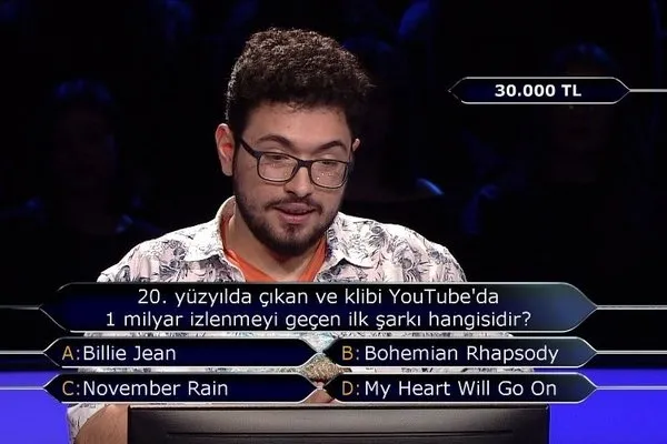 20. yüzyılda çıkan ve klibi YouTube'da 1 milyar izlenmeyi geçen ilk şarkı hangisidir? - 1