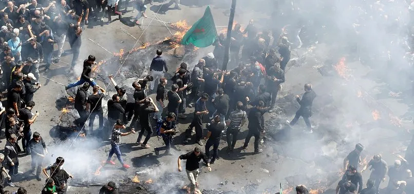 İRAN'DA BENZİN ZAMMI PROTESTOLARI SÜRÜYOR! BANKA ŞUBESİNİ ATEŞE VERDİLER!