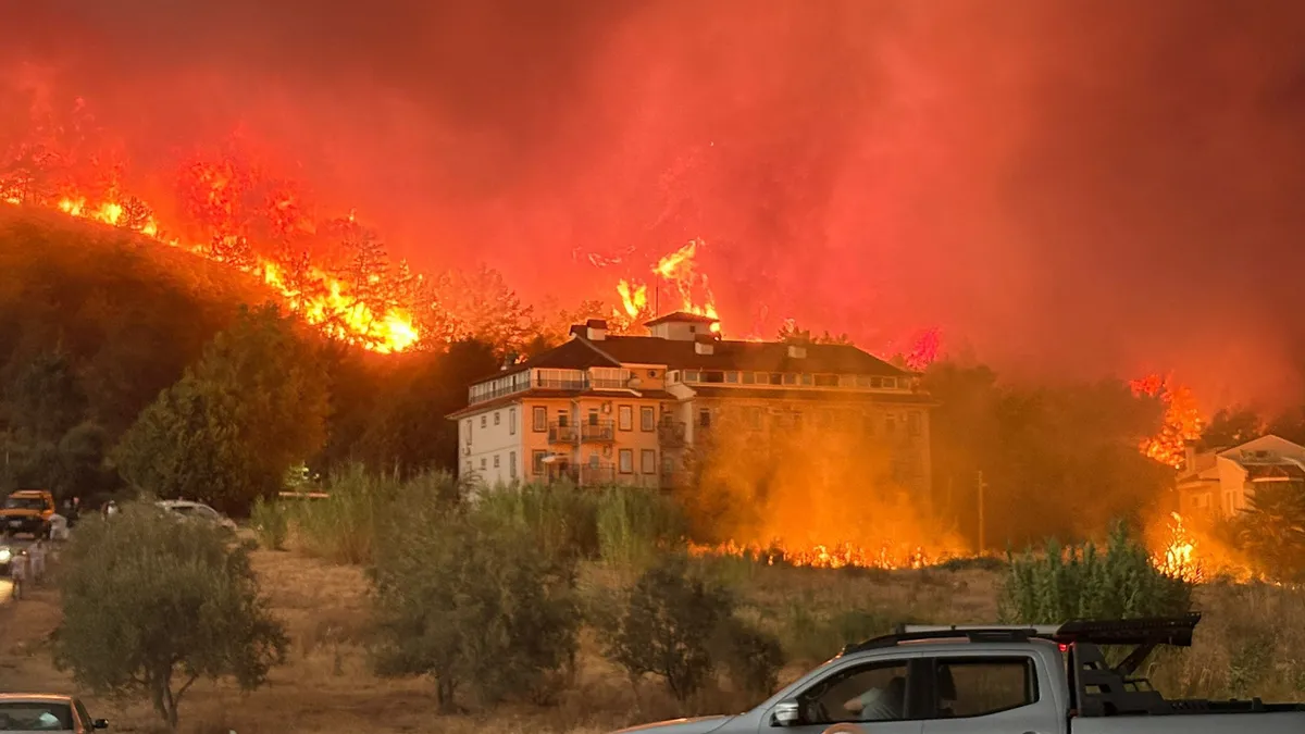 Photo: ahaber.com.tr Wildfire in Fethiye Brings Evacuations as Flames Come Under Control