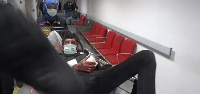Yarasını unutup sedye üzerinden kameramana saldırdı