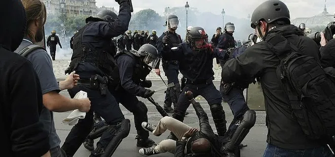 Fransız polisinden kadın göstericiye şiddet